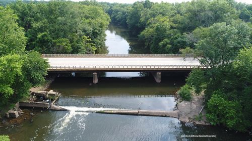 New Jersey’s Millstone River with bridge and dam. Image: Stony Brook-Millstone Watershed Association.